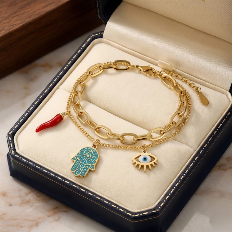 A gold bracelet made of rust-resistant stainless steel, with a design that combines blue palm, eye, and attractive red pepper charms, with an adjustable clasp to suit you. - Image 4